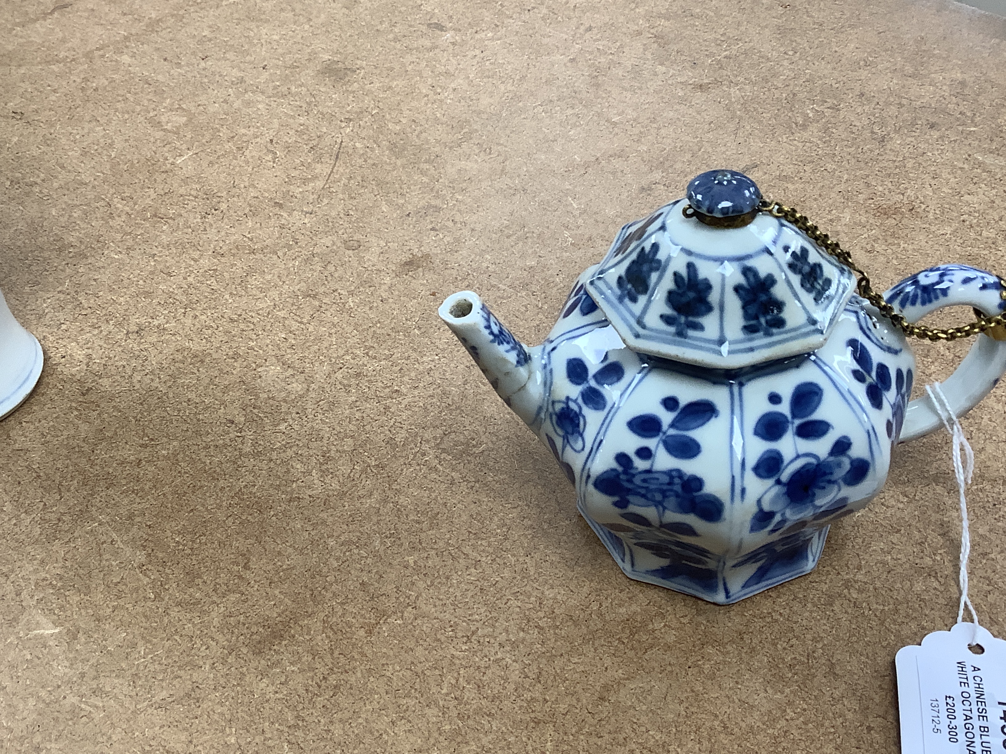 A Chinese blue and white octagonal teapot and cover with gilt metal mounts and a blue and white baluster vase, 16.5cm high, both 18th century